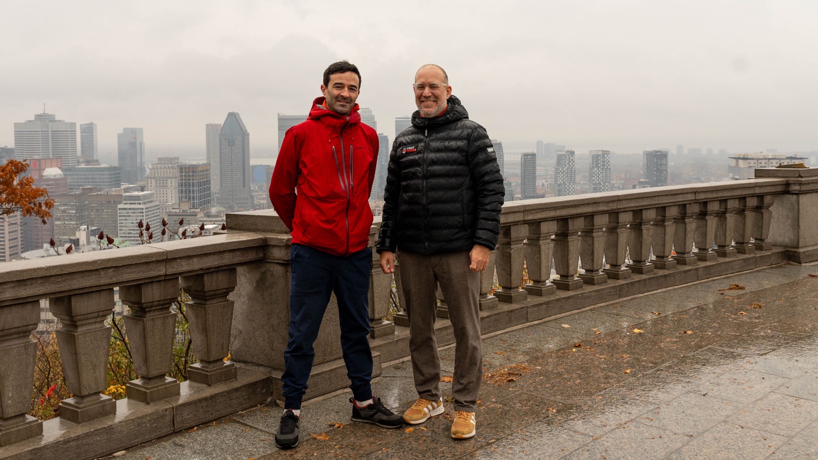 Hadrien and Hugh, Bloomsco’s co-founders, standing together with Montréal’s skyline behind them.